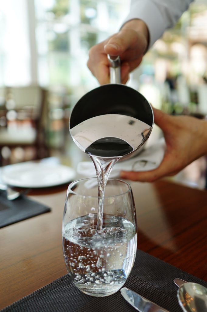 pouring water in a glass.