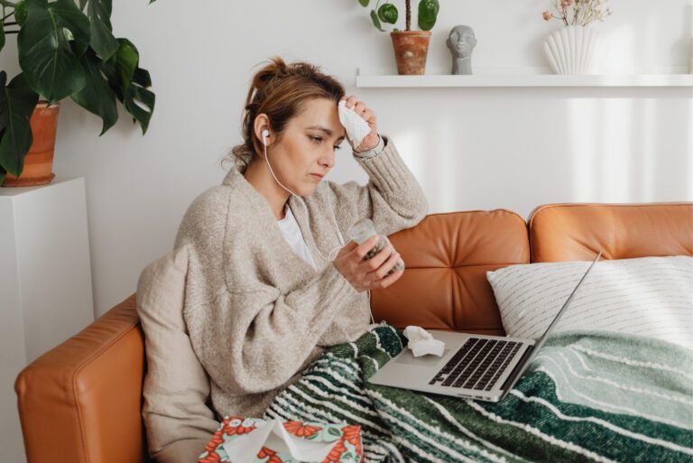 woman suffering from unbalanced hormones, thyroid health issues and menopause symptoms that need relief.