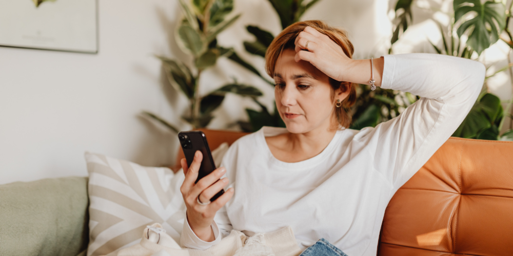 woman researching perimenopause symptoms and information